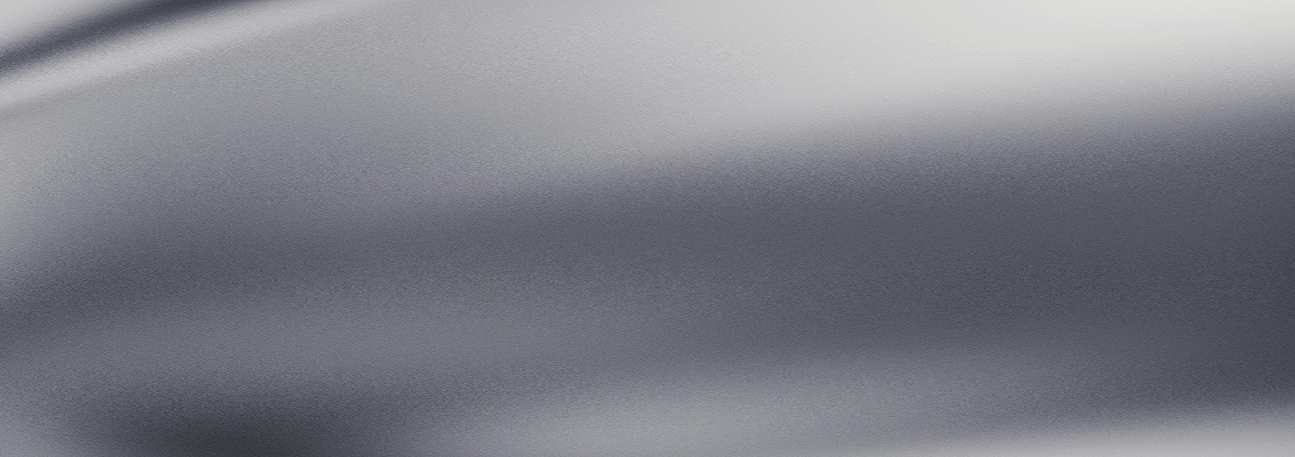 Smooth gray fabric surface with subtle texture.