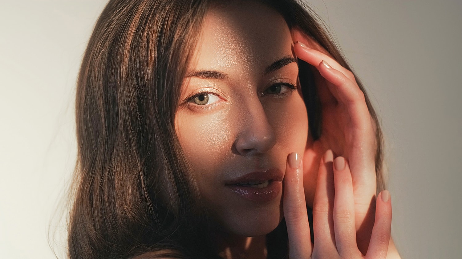 Woman with blonde hair in black jacket.
