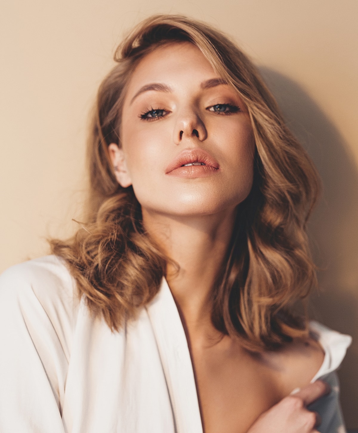 Black and white portrait of a woman in shirt.
