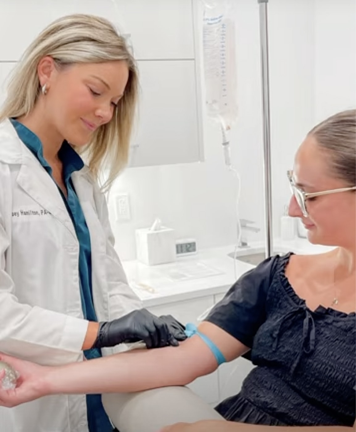 Medical professional preparing patient for procedure.