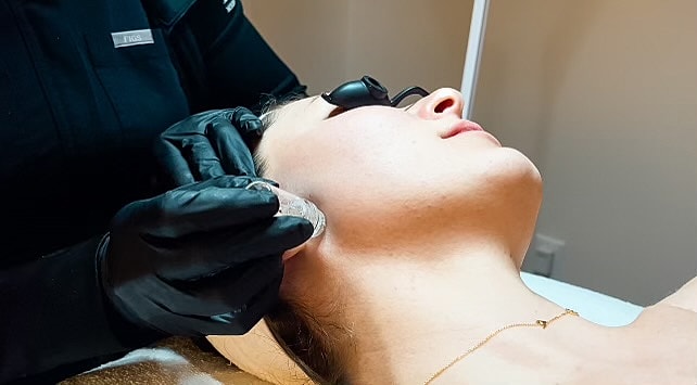 Skin treatment session in a spa setting.