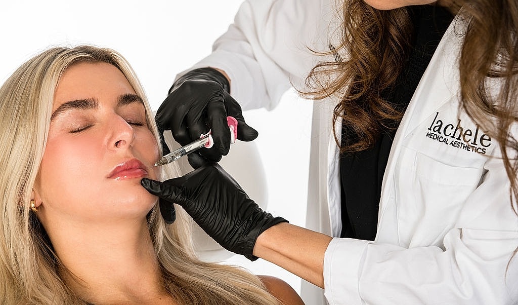 Injecting treatment in a beauty clinic session.