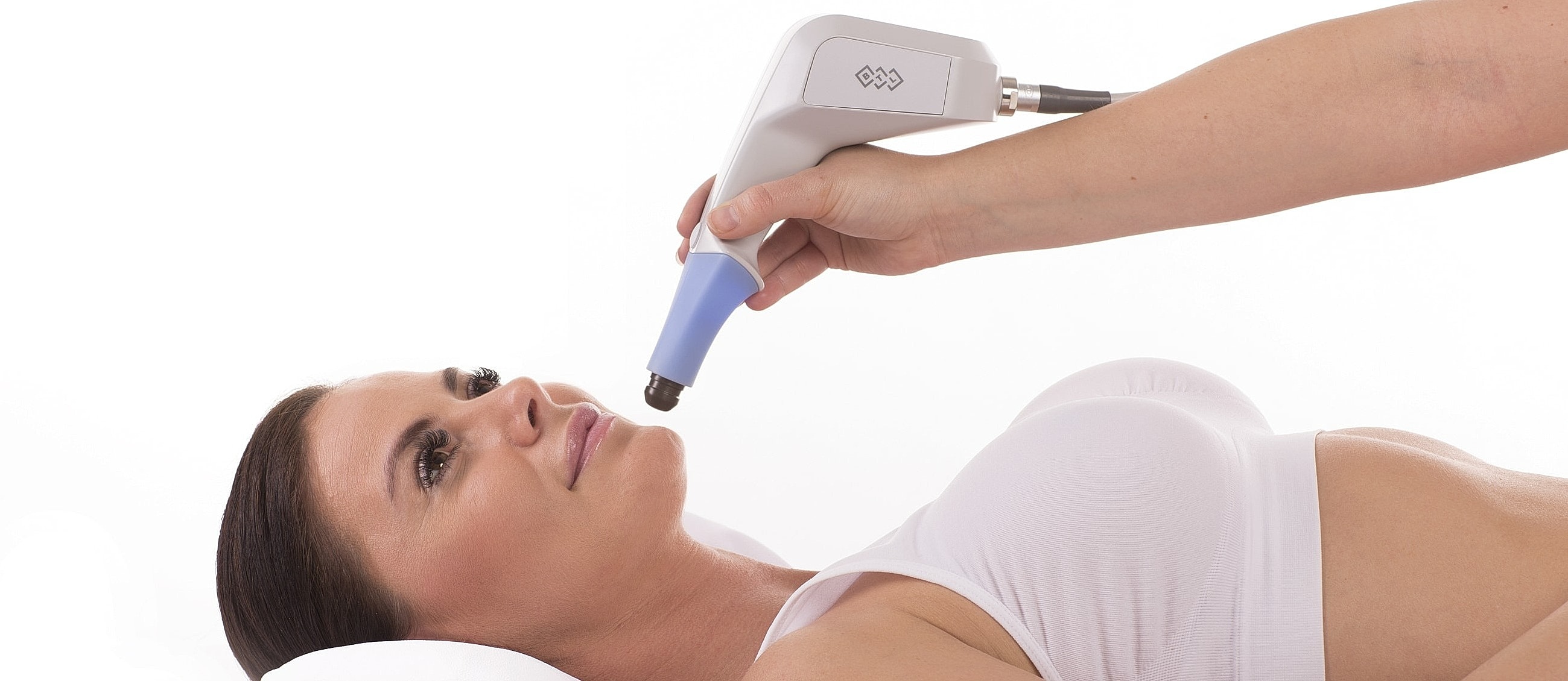 Female athlete stretching in gym attire.