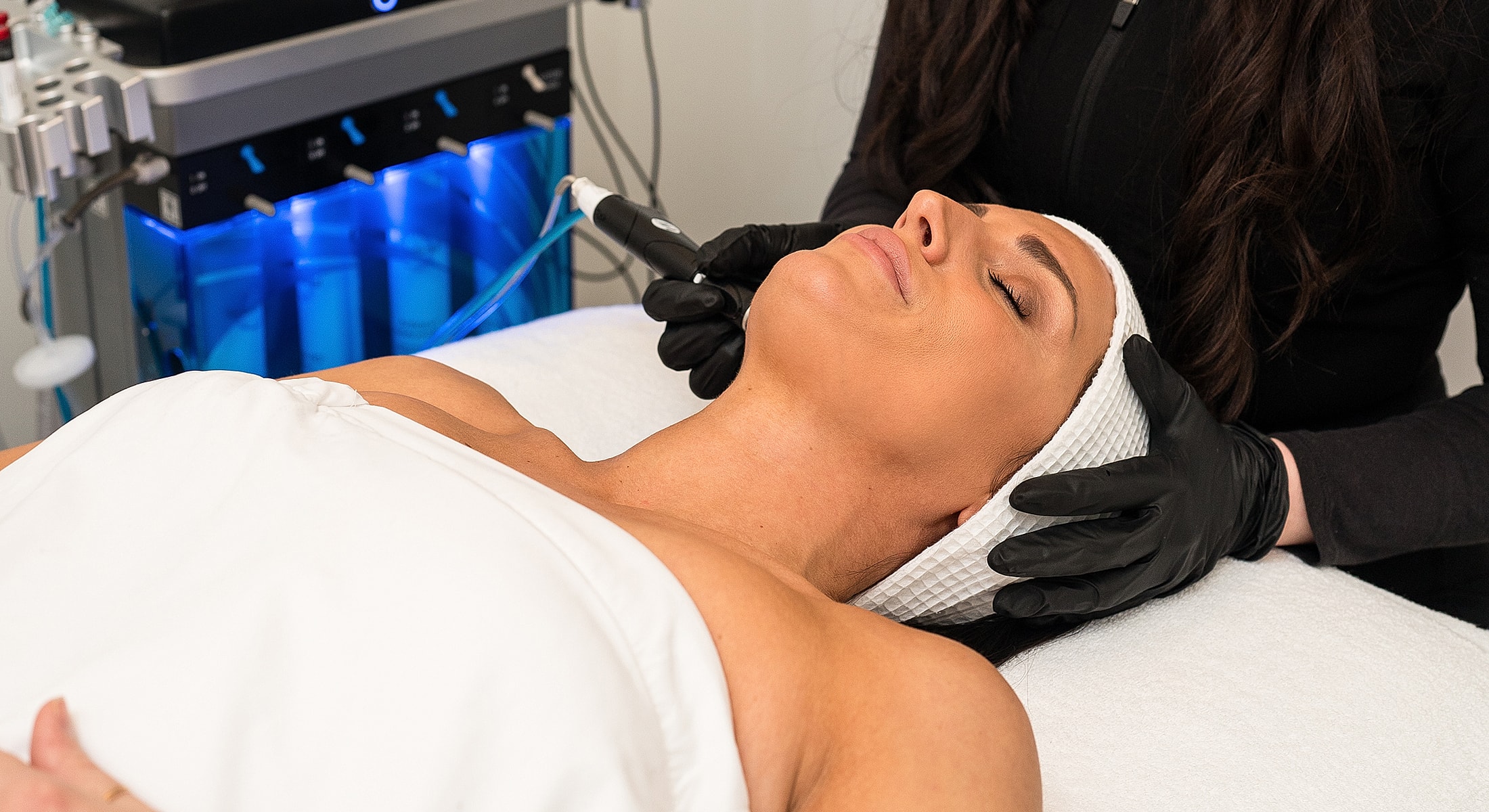 Facial treatment in progress at beauty salon.