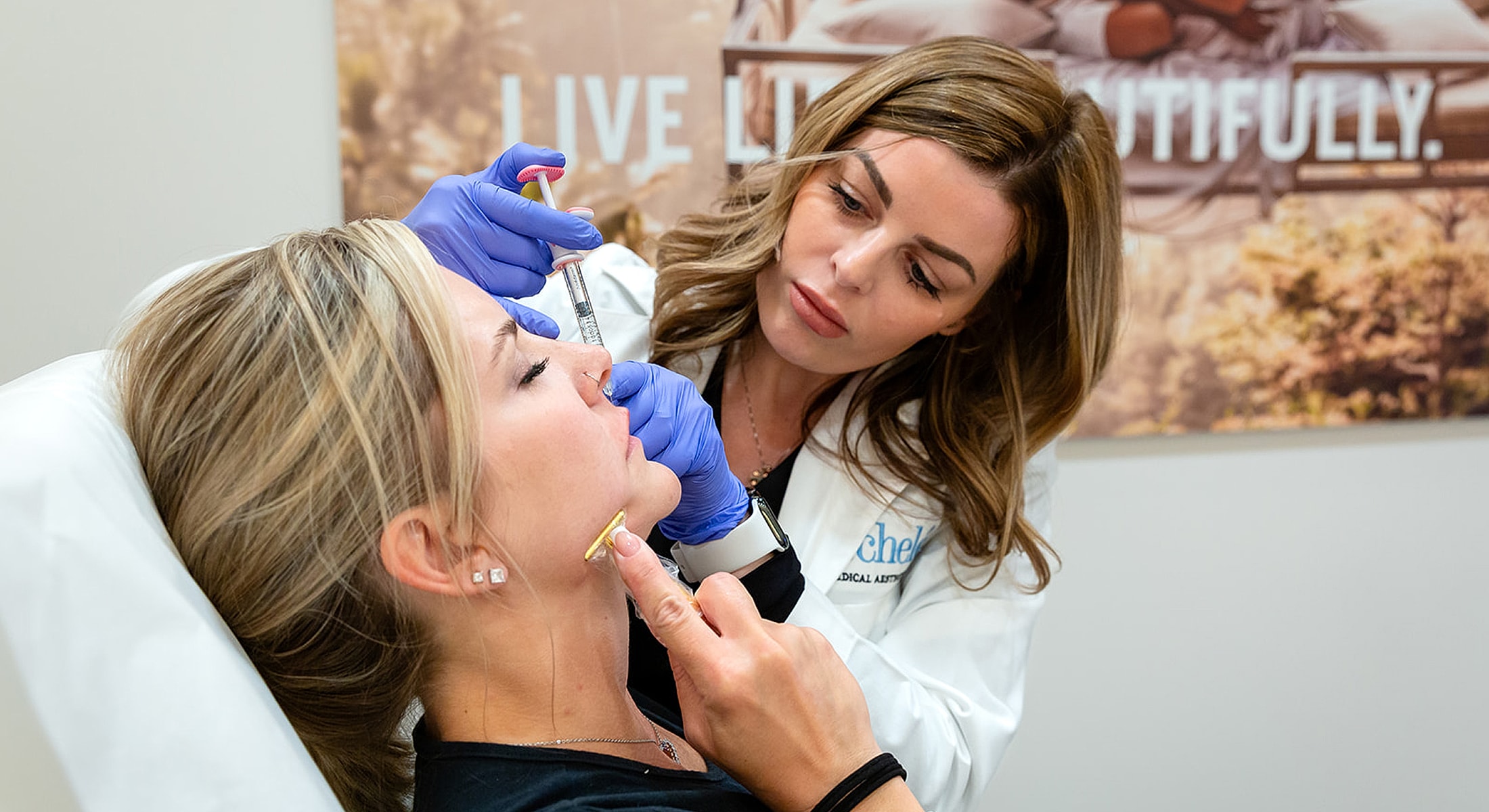Injecting treatment in a beauty clinic session.