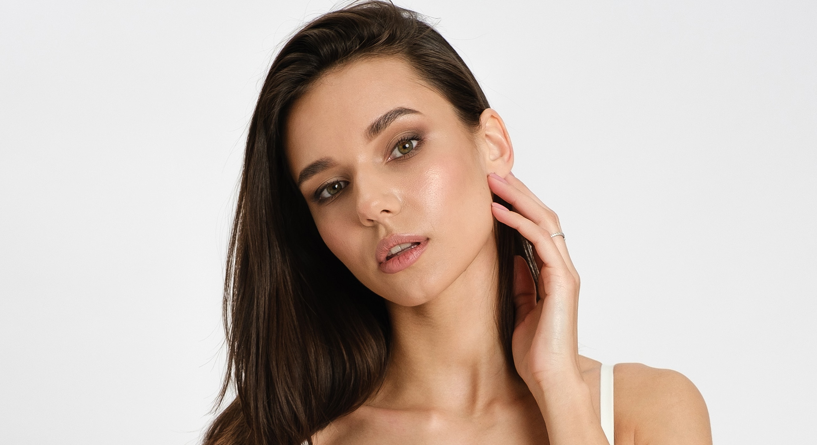 Young woman with long hair, serene expression.