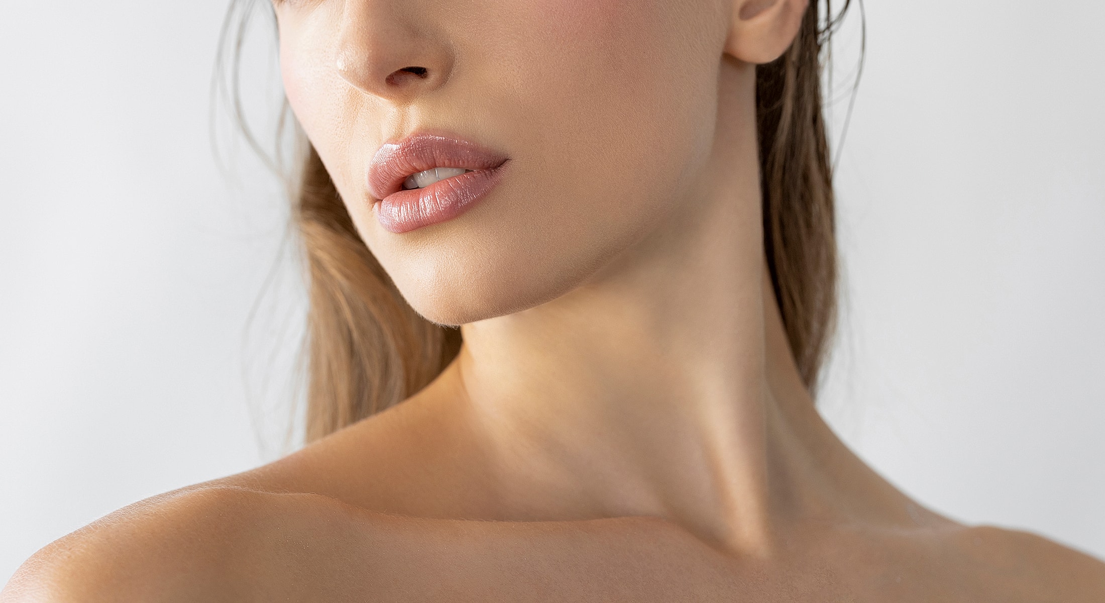 Close-up of a woman's face and neck.